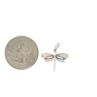 Inlaid wing dragonfly moissanite pendant in sterling silver with pearl wings, shown beside a US quarter for scale