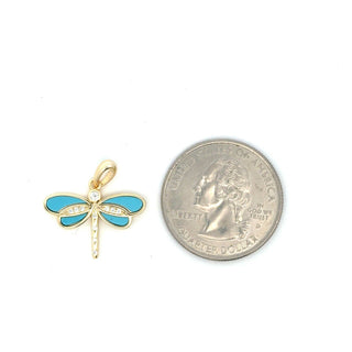 Inlaid wing dragonfly moissanite pendant in yellow gold vermeil with turquoise wings, shown beside a US quarter for scale