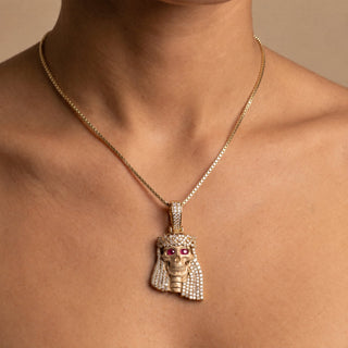 Superior Silver Jesus pendant in 14K yellow gold with natural diamonds and ruby eyes worn on a gold chain