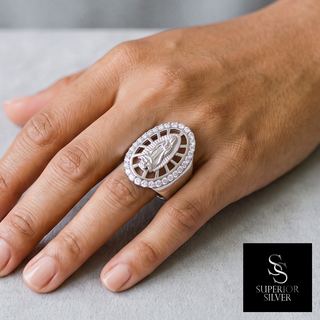 Lady of Guadalupe Oval Halo Wide Band Moissanite Ring in sterling silver, worn on hand