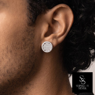 Large round pavé dome moissanite stud earrings in sterling silver, worn on model