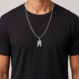 Layered Pavé Angel Wings Moissanite Pendant in sterling silver, worn on model