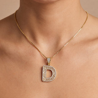 Superior Silver gold initial D pendant featuring pave-set cubic zirconia stones worn on a delicate gold chain
