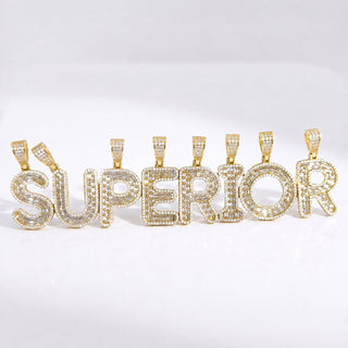 Superior Silver gold initial pendants spelling SUPERIOR, featuring pave-set CZ stones on 14kt gold over sterling silver.