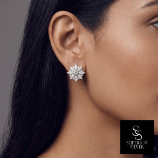 Marquise starburst moissanite stud earrings in sterling silver, worn on model