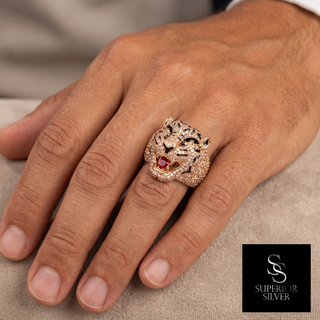 Men's 14K rose gold diamond panther ring shown on hand
