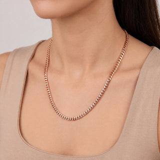 Superior Silver 16-inch 3.9mm solid 10K rose gold Miami Cuban link chain worn around a woman's neck