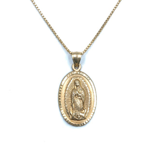 Superior Silver 10K yellow gold oval Mother Mary medallion pendant with diamond-cut detailing on a gold chain