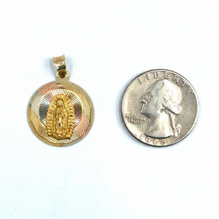 Superior Silver 14K tri-color gold Mother Mary medallion pendant with diamond-cut detailing next to a US quarter.