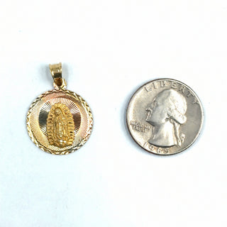 Superior Silver 14K tri-color gold Mother Mary medallion pendant with diamond-cut detailing next to a US quarter.