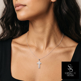Open Double-Outline Pavé Cross Moissanite Pendant in sterling silver, worn on model
