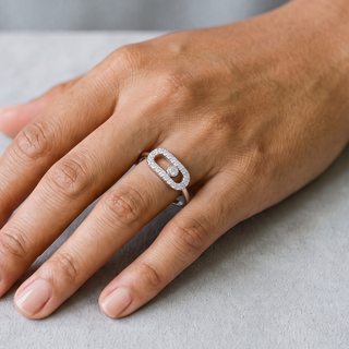 Open Pavé Oval with Sliding Bezel Stone Moissanite Ring in sterling silver, worn on hand