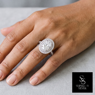 Oval Double Halo Moissanite Ring in sterling silver, worn on hand
