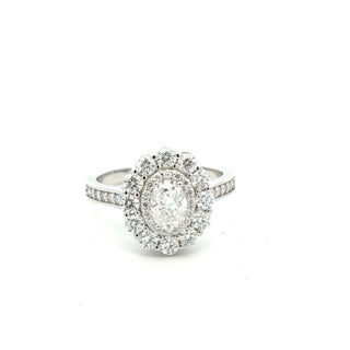 Oval floral halo on pavé band moissanite ring in sterling silver