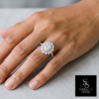Oval Floral Halo on Pavé Band Moissanite Ring in sterling silver, worn on hand