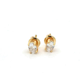 Oval four-prong solitaire moissanite stud earrings in yellow gold vermeil over sterling silver