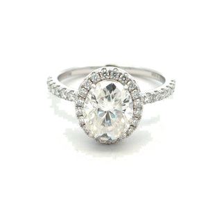 Oval halo on pavé band moissanite ring in sterling silver