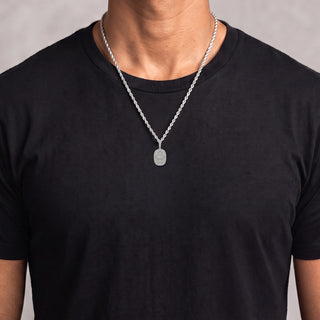 Oval Sunburst Hamsa Medallion with Evil Eye Moissanite Pendant in sterling silver, worn on model