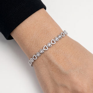 Pavé Heart and Solitaire Heart Link Moissanite Bracelet in Sterling Silver worn on the wrist
