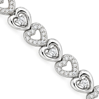 Pavé heart and solitaire heart link moissanite bracelet in sterling silver, close-up of heart links