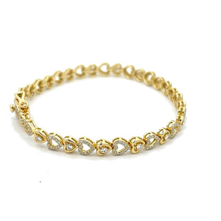 Pavé heart and solitaire heart link moissanite bracelet in yellow gold vermeil over sterling silver