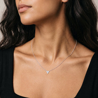 Pavé Heart Moissanite Necklace in sterling silver, worn on model