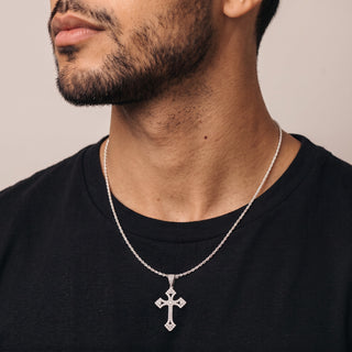 Pavé Pointed-Tip Cross Moissanite Pendant in sterling silver, worn on model