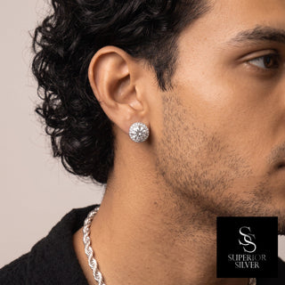 Pavé-sided round halo moissanite stud earrings in sterling silver, worn on model