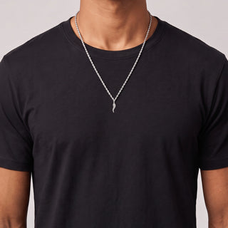 Pavé Twisted Italian Horn Moissanite Pendant in sterling silver, worn on model