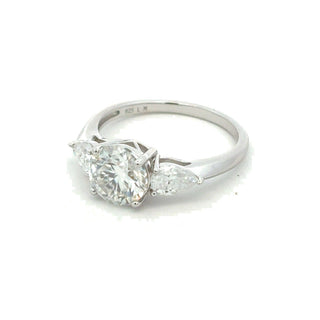 Pear-Flanked round three-stone moissanite ring in sterling silver