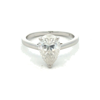 Pear solitaire on polished band moissanite ring in sterling silver