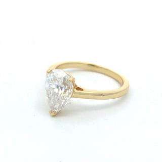 Pear solitaire on polished band moissanite ring in yellow gold vermeil over sterling silver