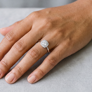 Petite Round Cluster Halo on Plain Band Moissanite Ring in sterling silver, worn on hand