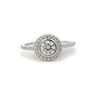 Petite round halo on pavé band moissanite ring in sterling silver