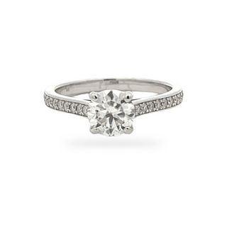 Petite round solitaire on pavé band moissanite ring in sterling silver