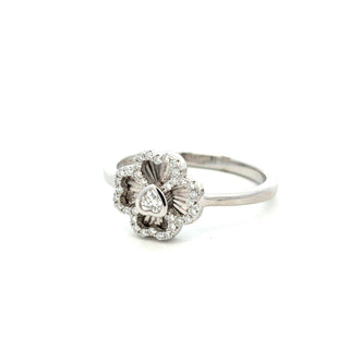 Polished four-petal flower moissanite ring in sterling silver