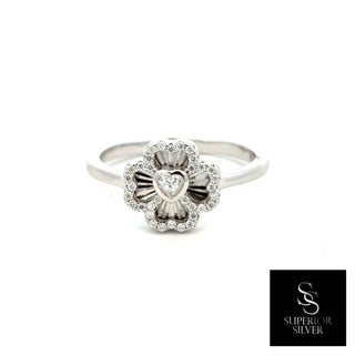 Polished four-petal flower moissanite ring in sterling silver, view 2
