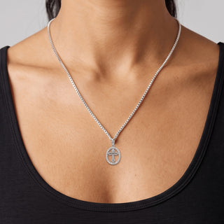 Polished Gothic Cross with Pavé Oval Halo Moissanite Pendant in sterling silver, worn on model