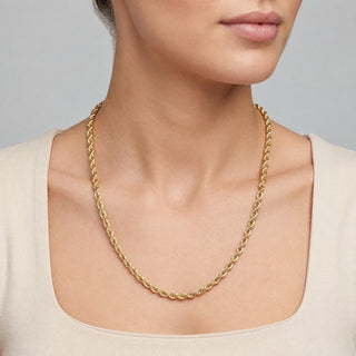 Superior Silver 10K yellow gold 4.2mm rope chain necklace worn on a model, featuring a polished twisted link design.