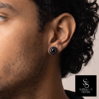 Round center cluster halo moissanite stud earrings in black rhodium over sterling silver, worn on model
