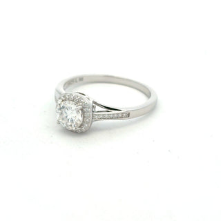 Round center halo on pavé shank moissanite ring in sterling silver