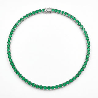Superior Silver 18 inch tennis chain with round cut natural emeralds in a four-prong sterling silver setting.