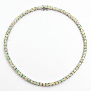 Superior Silver round cut Ethiopian opal tennis chain in 925 sterling silver with green and orange fire flashes.