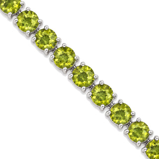 Round cut peridot tennis bracelet in sterling silver, close-up of peridots in four-prong settings