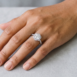 Round Floral Halo on Pavé Band Moissanite Ring in sterling silver, worn on hand