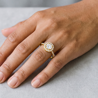 Round Halo on Thin Micro Pavé Band Moissanite Ring in yellow gold over sterling silver, worn on hand