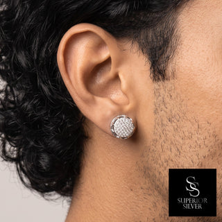 Round pavé cluster open gallery moissanite stud earrings in sterling silver, worn on model