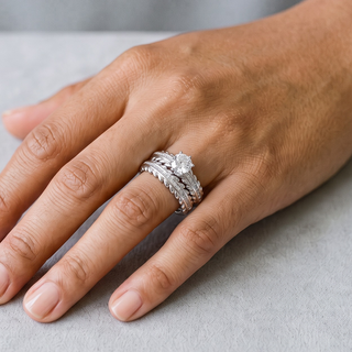 Round Solitaire Baguette Leaf Bridal Set Moissanite Ring in sterling silver, worn on hand