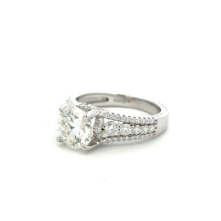 Round solitaire on split pavé shank moissanite ring in sterling silver