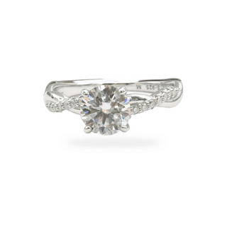 Round solitaire on twisted bypass pavé shank moissanite ring in sterling silver